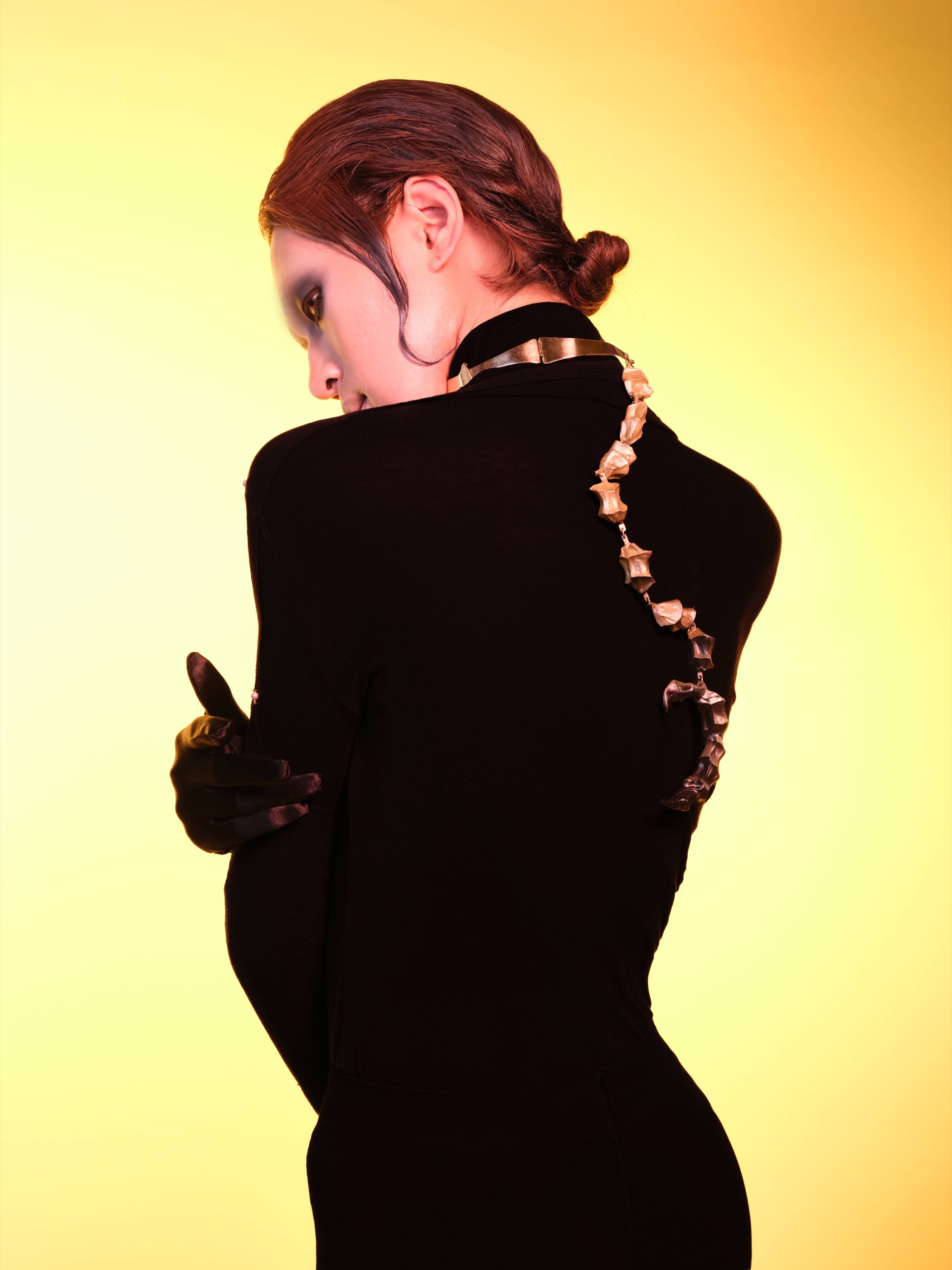 Regulation — choker worn on the back