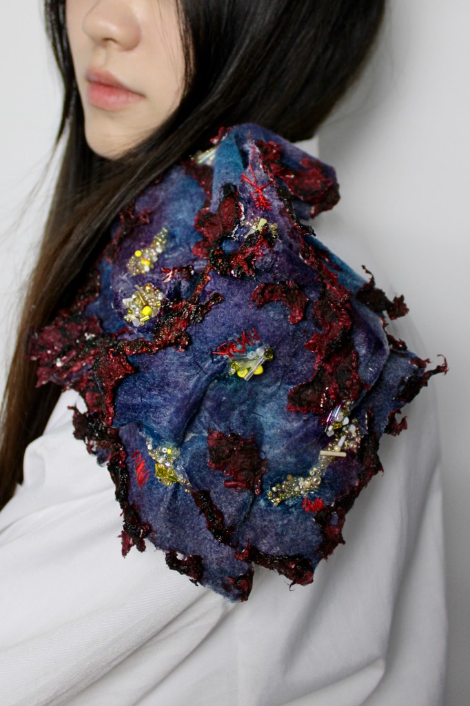 Heat — shoulder ornament worn on white shirt