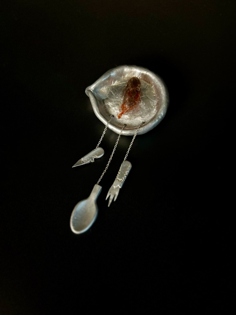 Heat — brooch with miniature cutlery
