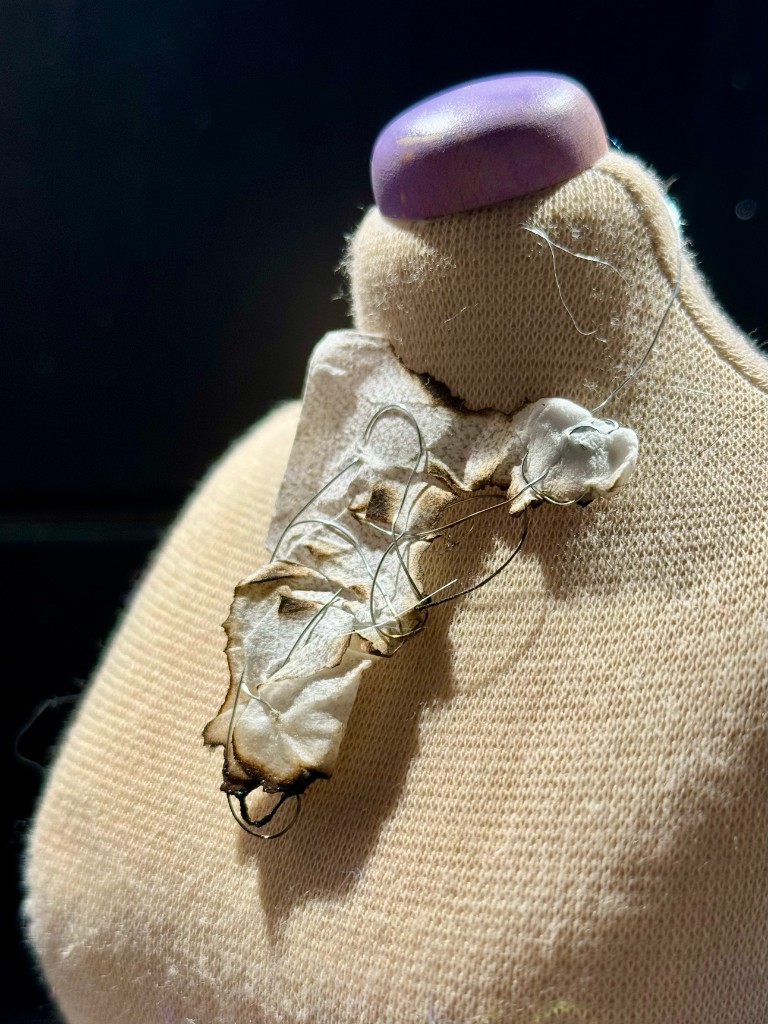Ember — necklace on mini mannequin, side view