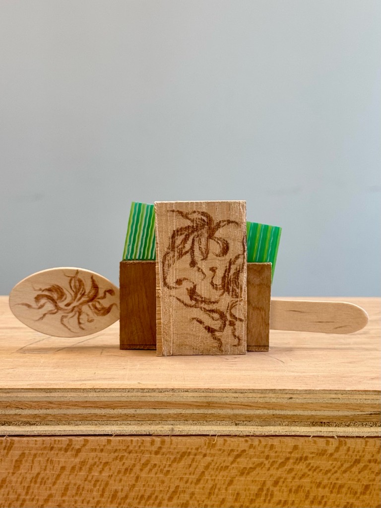 Material Before Form — wood and striped acrylic prototype