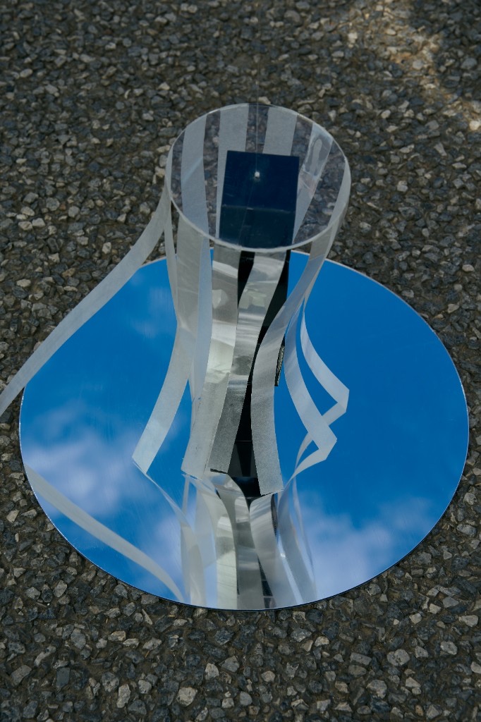 Round Heaven, Square Earth — striped cylinder on circular mirror