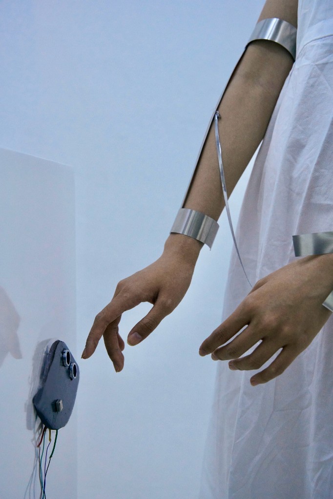Light by Distance — wearable metal piece and sensor