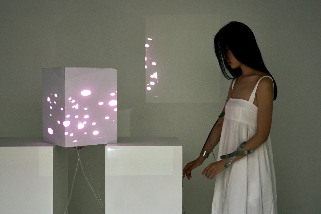 Light by Distance — body connected to perforated light cube