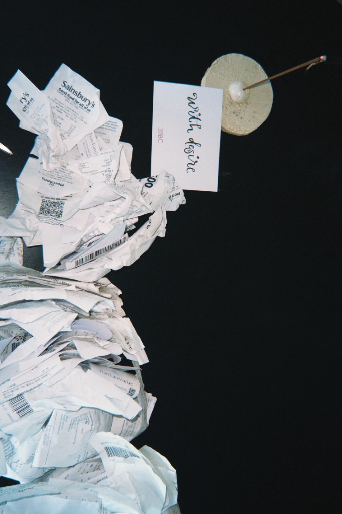 Receipts, incense and a card reading with desire
