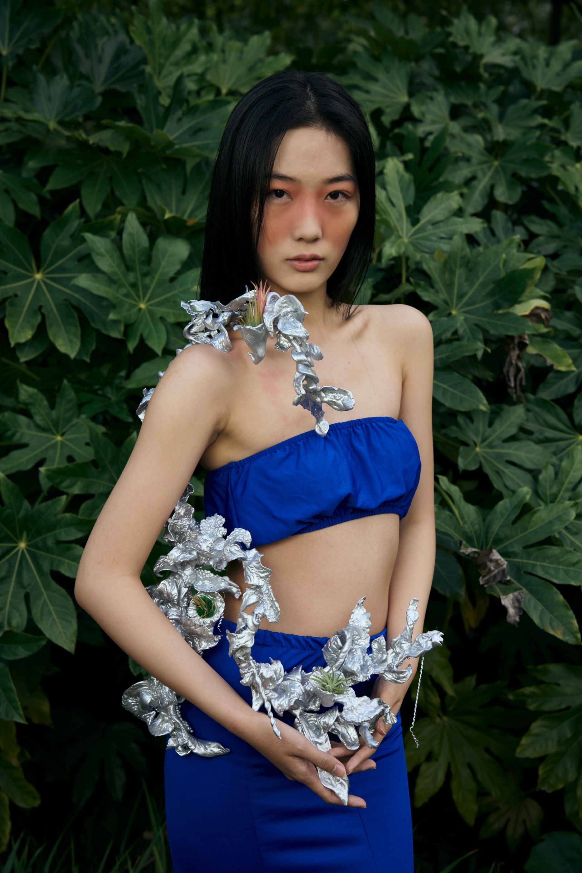 The Rhythm shoulder accessories against foliage